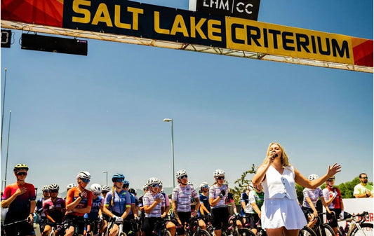 Alli singing in front of the Salt Lake criterium bike racers