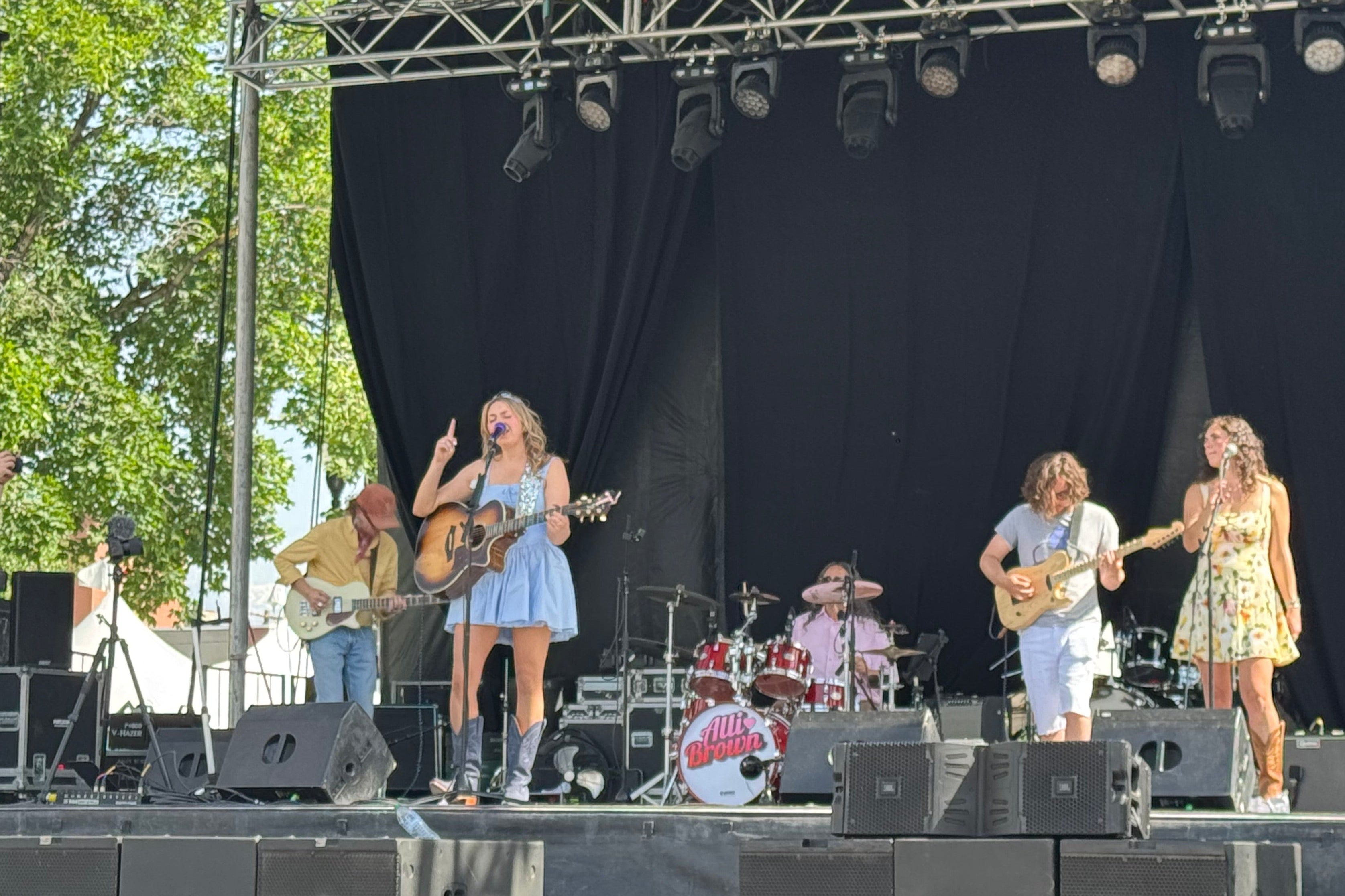 Load video: Alli Brown and her band performing on a large stage